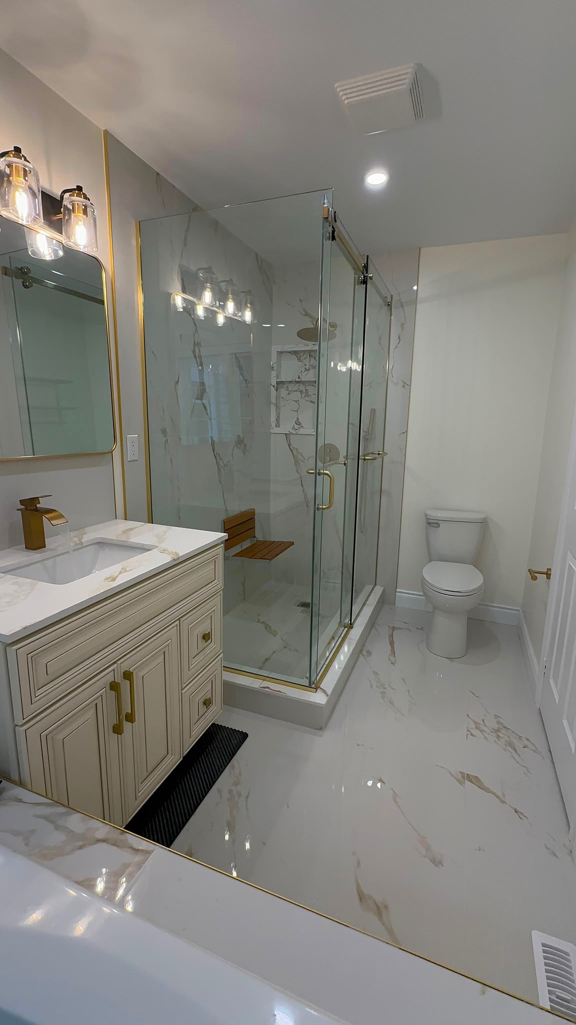 Luxury gold fixture bathroom renovation by Reliance Contracting 168