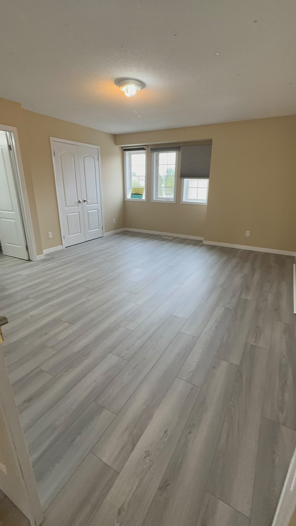 Large room with grey vinyl flooring