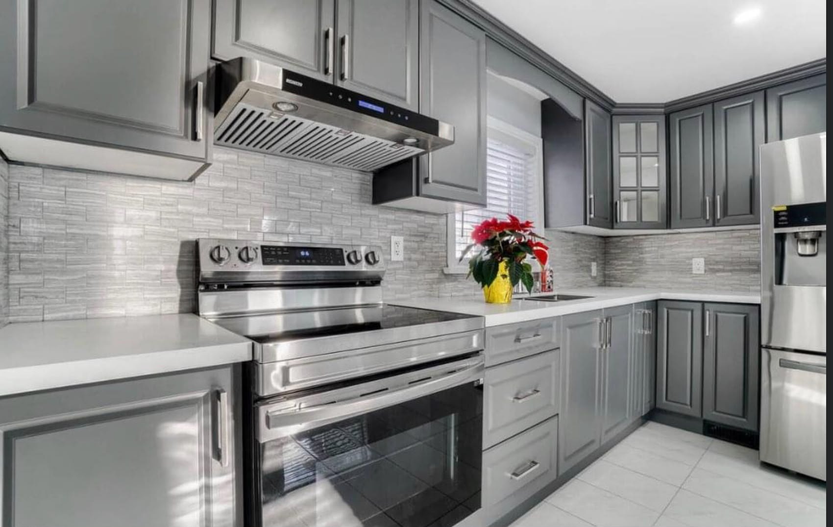 Grey Kitchen With Tile Backsplash by Reliance Contracting 168
