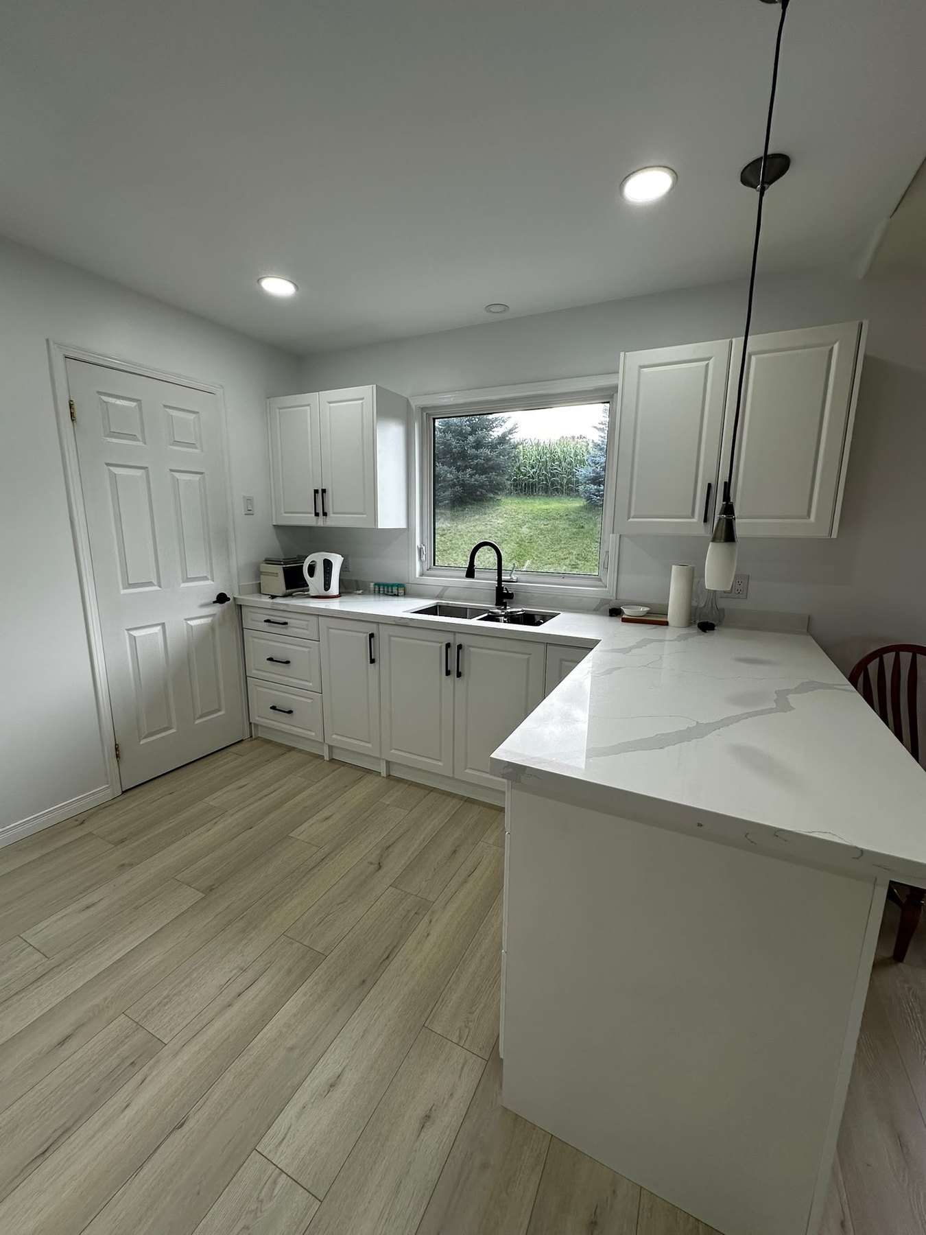 White Kitchen & Dining Area by Reliance Contracting 168
