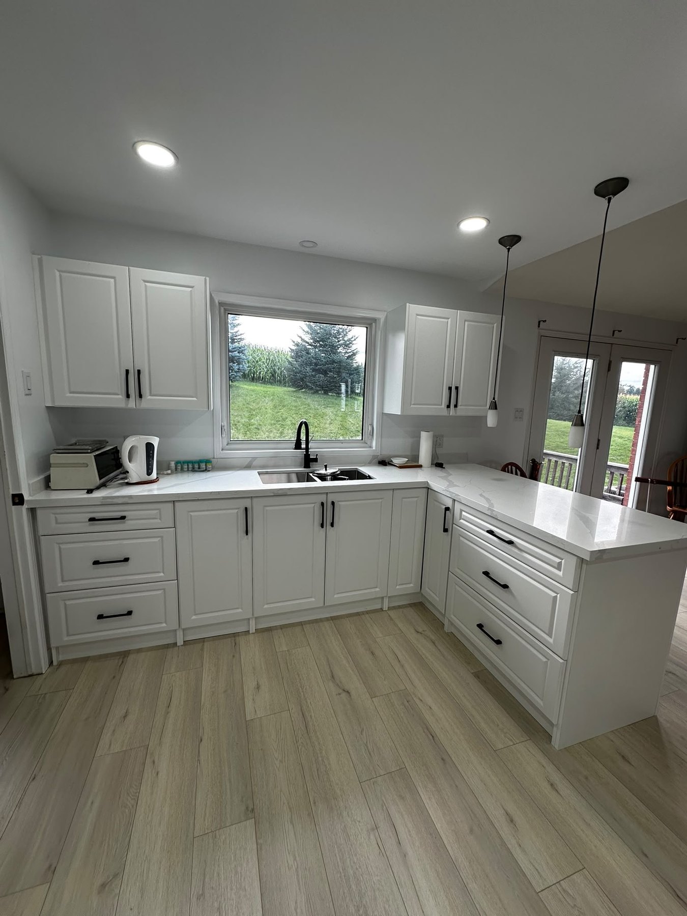 Open White Kitchen by Reliance Contracting 168